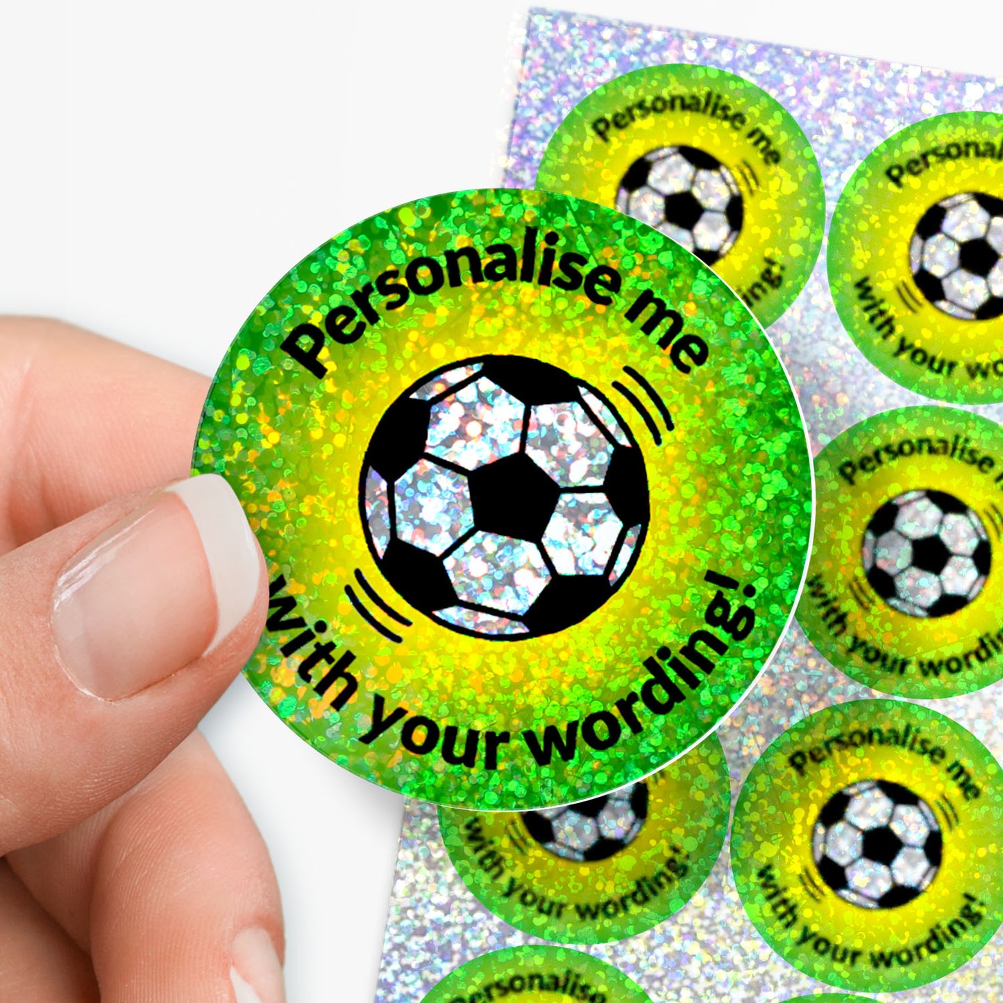 Personalised holographic green stickers with football design and text 'Personalise me with your wording!' held by a hand.