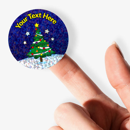 Personalisable sticker with Christmas tree design held by a finger on a white background