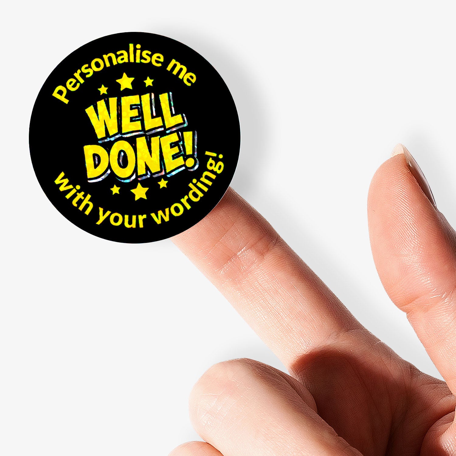 Personalised holographic round sticker with 'Well Done!' text held by a finger.