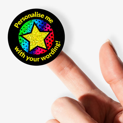 Colorful star sticker with text 'Personalise me with your wording!' held by a hand.