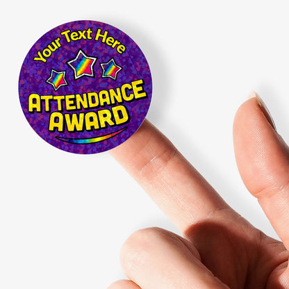 Round purple personalised holographic Attendance Award sticker with 'Your Text Here' text held by a finger.