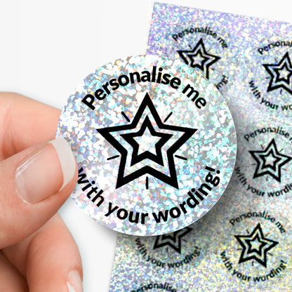 Personalised round holographic Silver sticker with star design and text 'Personalise me with your wording!' held by a hand.