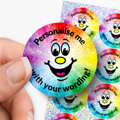 Colorful round stickers with a smiling face and text 'Personalise me with your wording!' held by a hand.