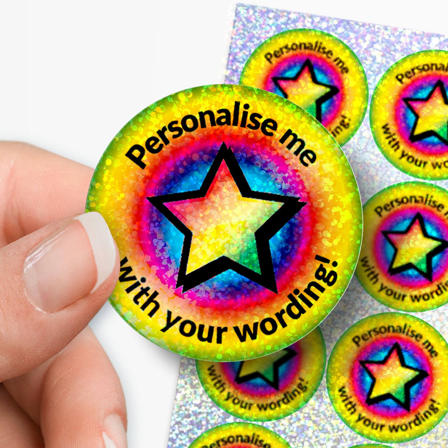 Colourful star-shaped stickers with text 'Personalise me with your wording!' held by a hand.