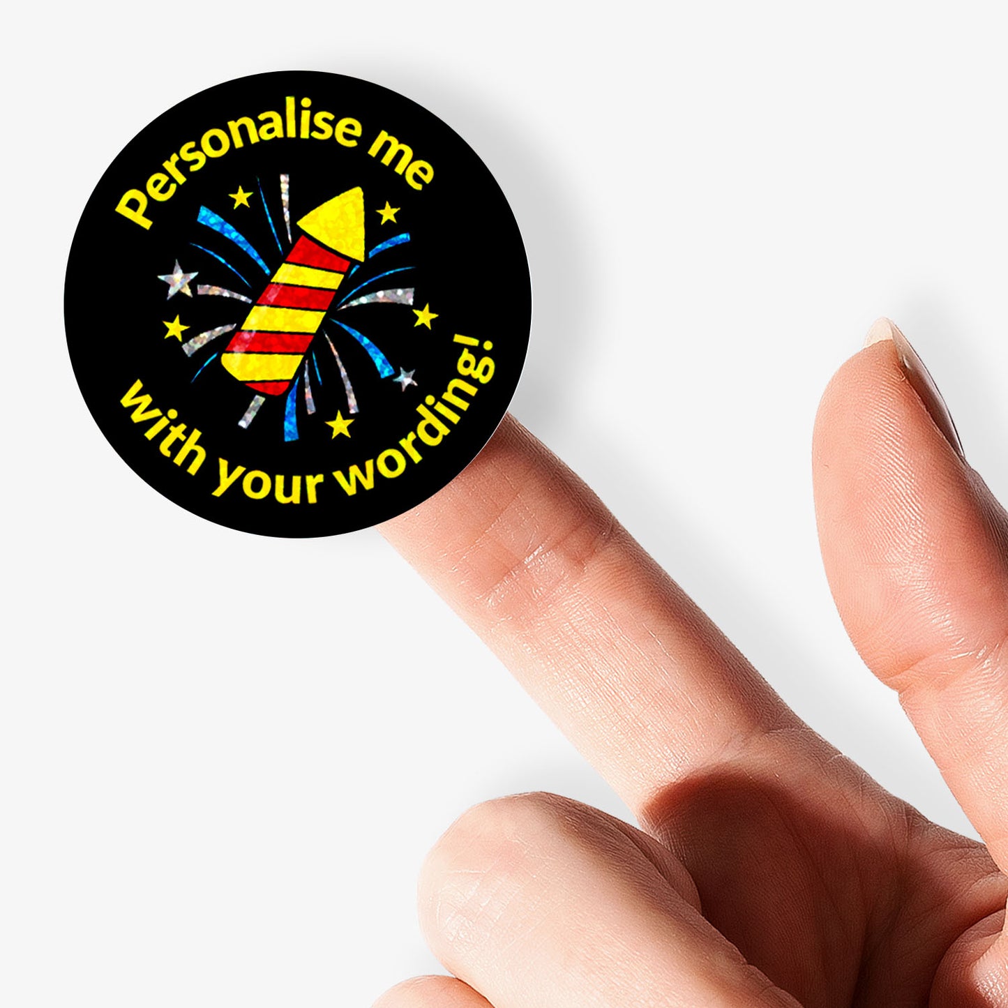 Round sparkly sticker with text 'Personalise me with your wording!' held by a finger on a white background