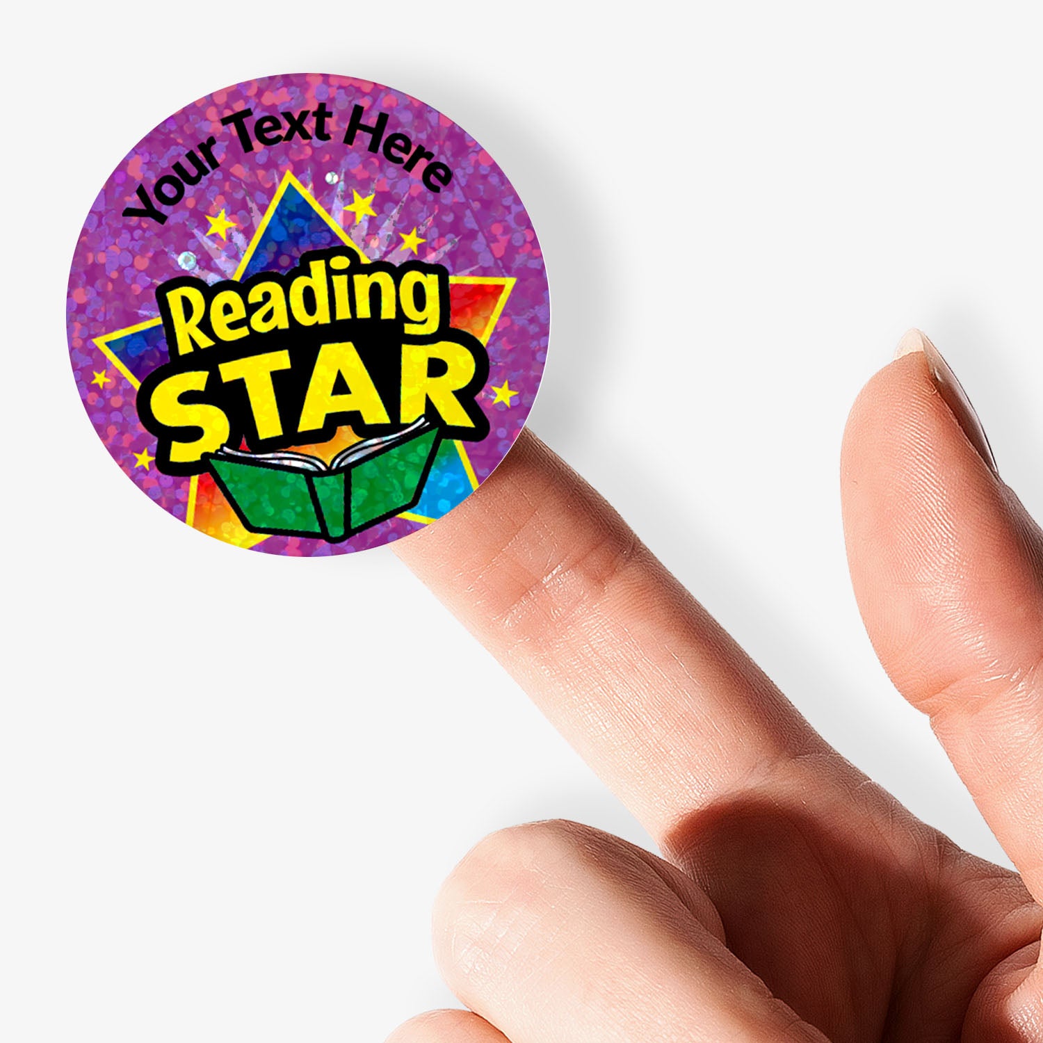 Sticker with 'Reading Star' design held by a finger on a white background