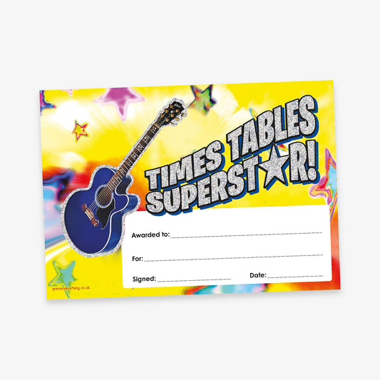 A vibrant 'Times Tables Superstar!' certificate with a bold, energetic design. The background features a burst of yellow and rainbow colours with stars scattered throughout. A blue acoustic guitar appears on the left side. The title 'Times Tables Superstar!' is written in large glittery text with a star symbol. At the bottom right, there are blank lines labelled: 'Awarded to:', 'For:', 'Signed:', and 'Date:'.