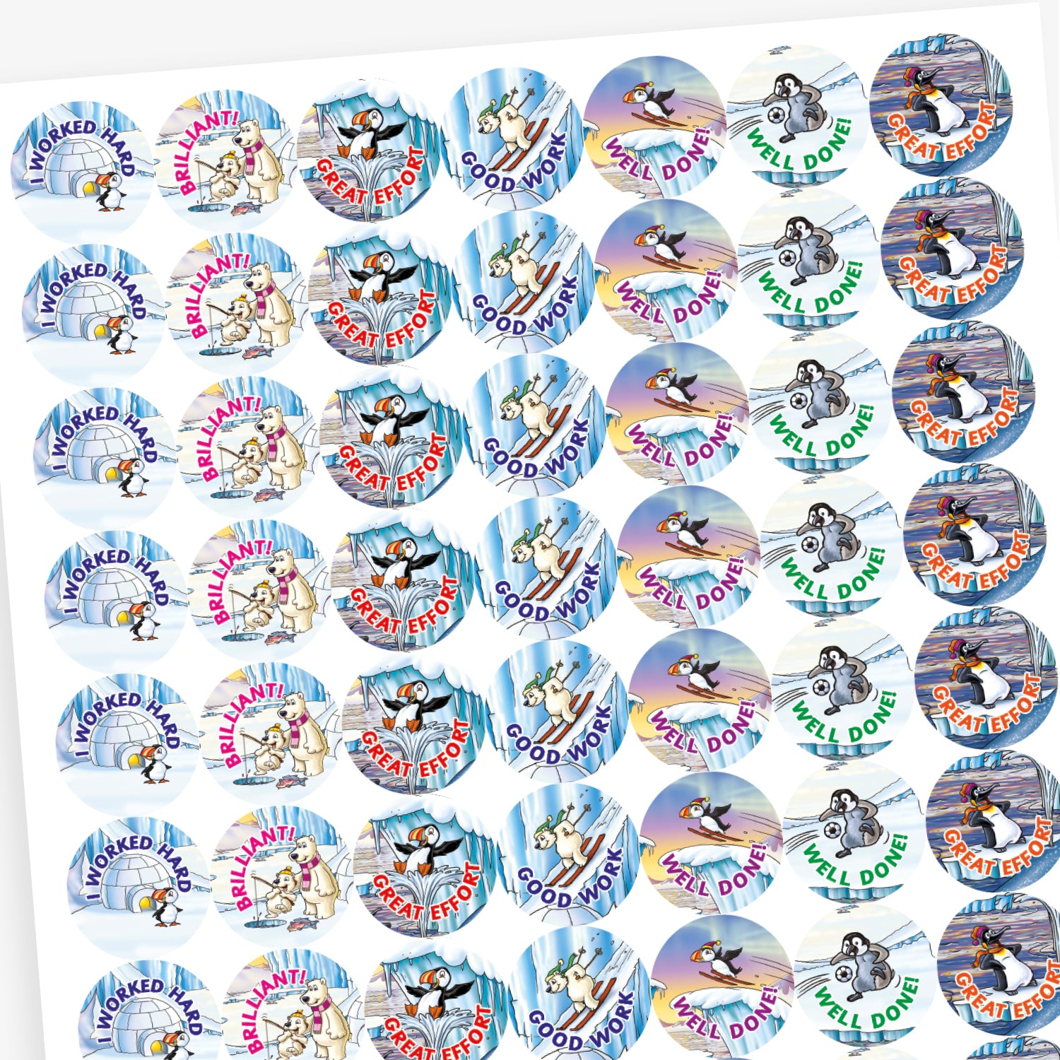 A sheet of circular reward stickers with phrases including 'I worked hard', 'Good Work', 'Well done' and 'Great Effort' in colourful text. Each sticker features arctic-themed cartoon animals such as puffins, polar bears, and walruses, engaging in playful activities against icy, snowy backdrops. 