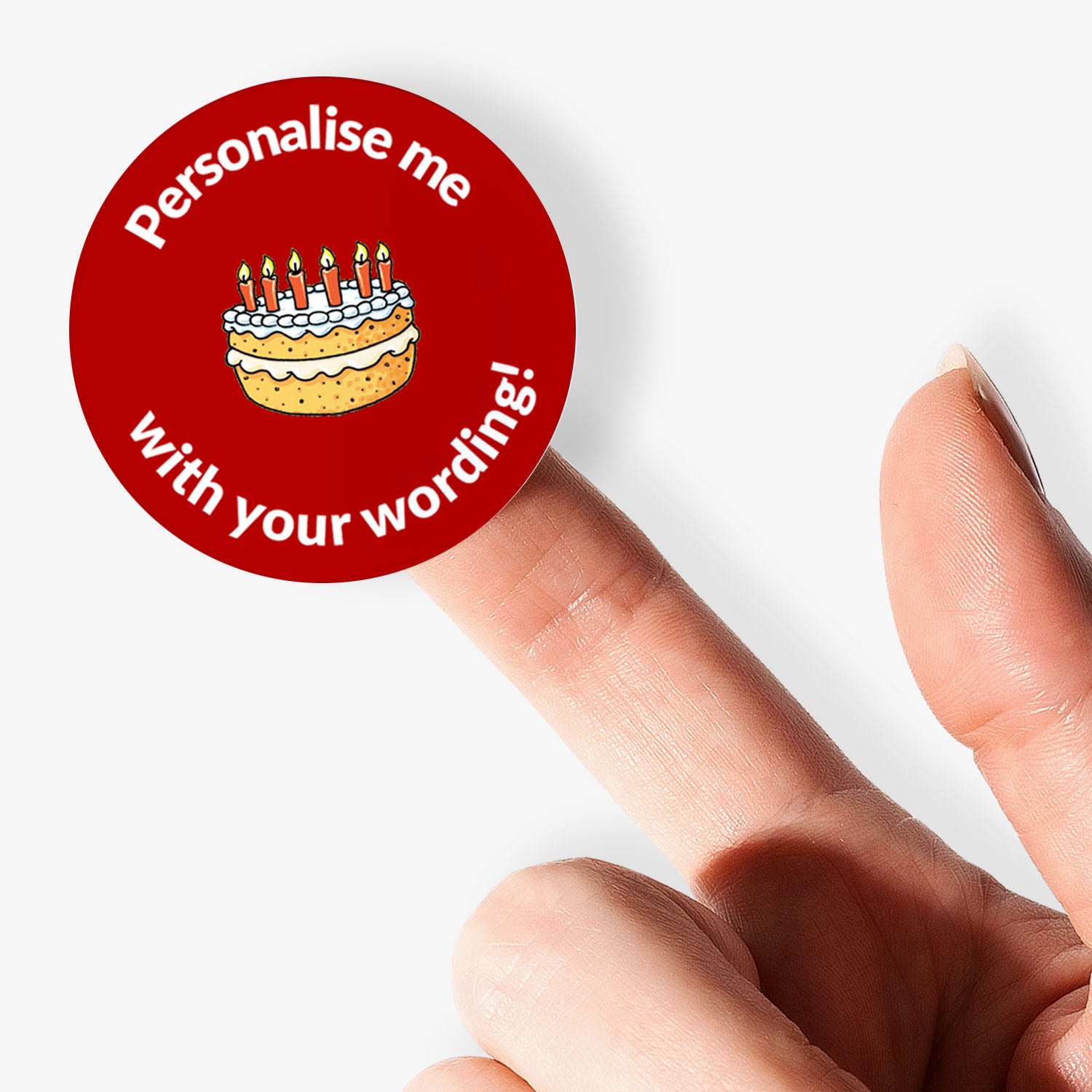 Red sticker on a finger with a birthday cake as the central image.  Space for personalisation above and below the image.