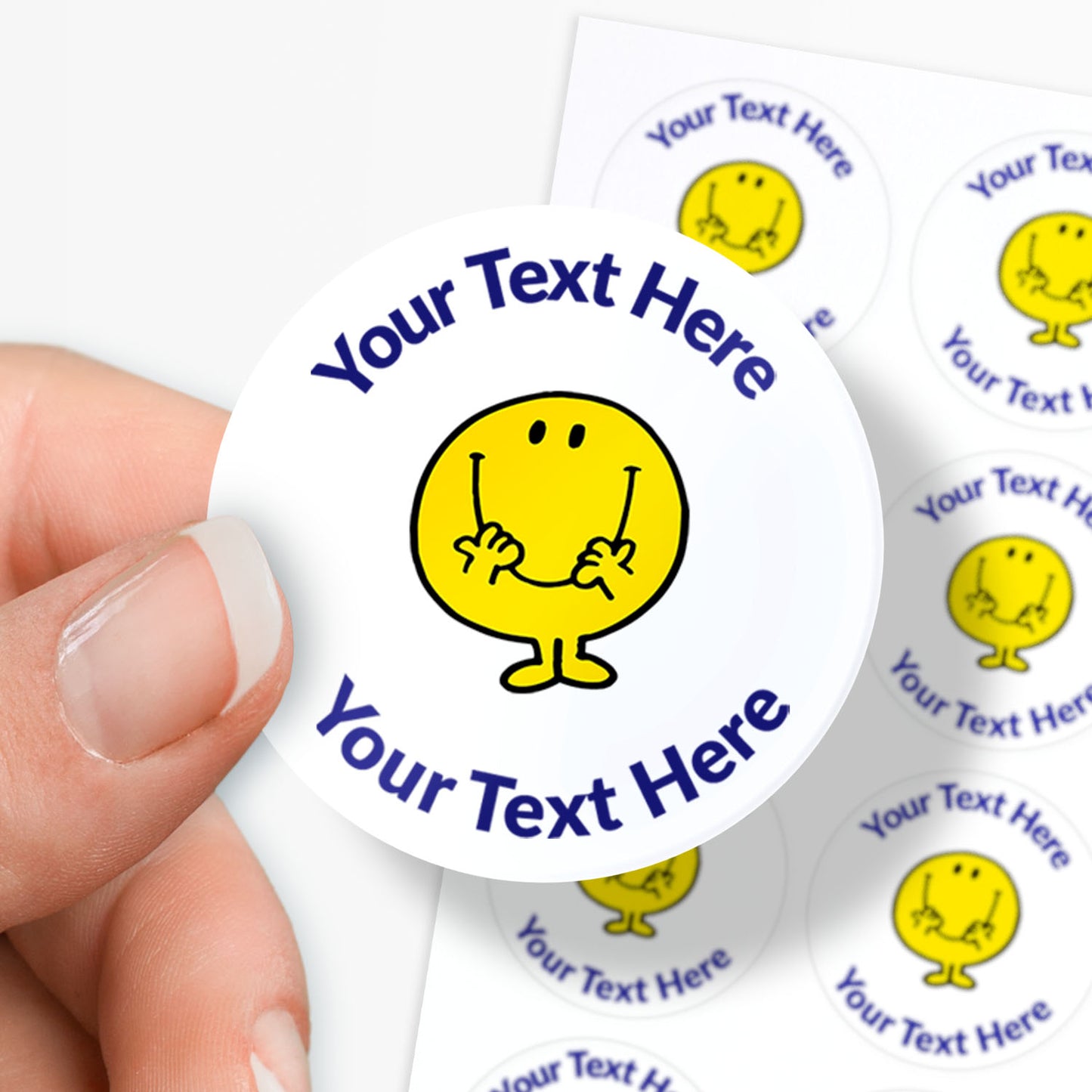 Personalisable sticker with a Mr Men character and customisable text area held by a hand.