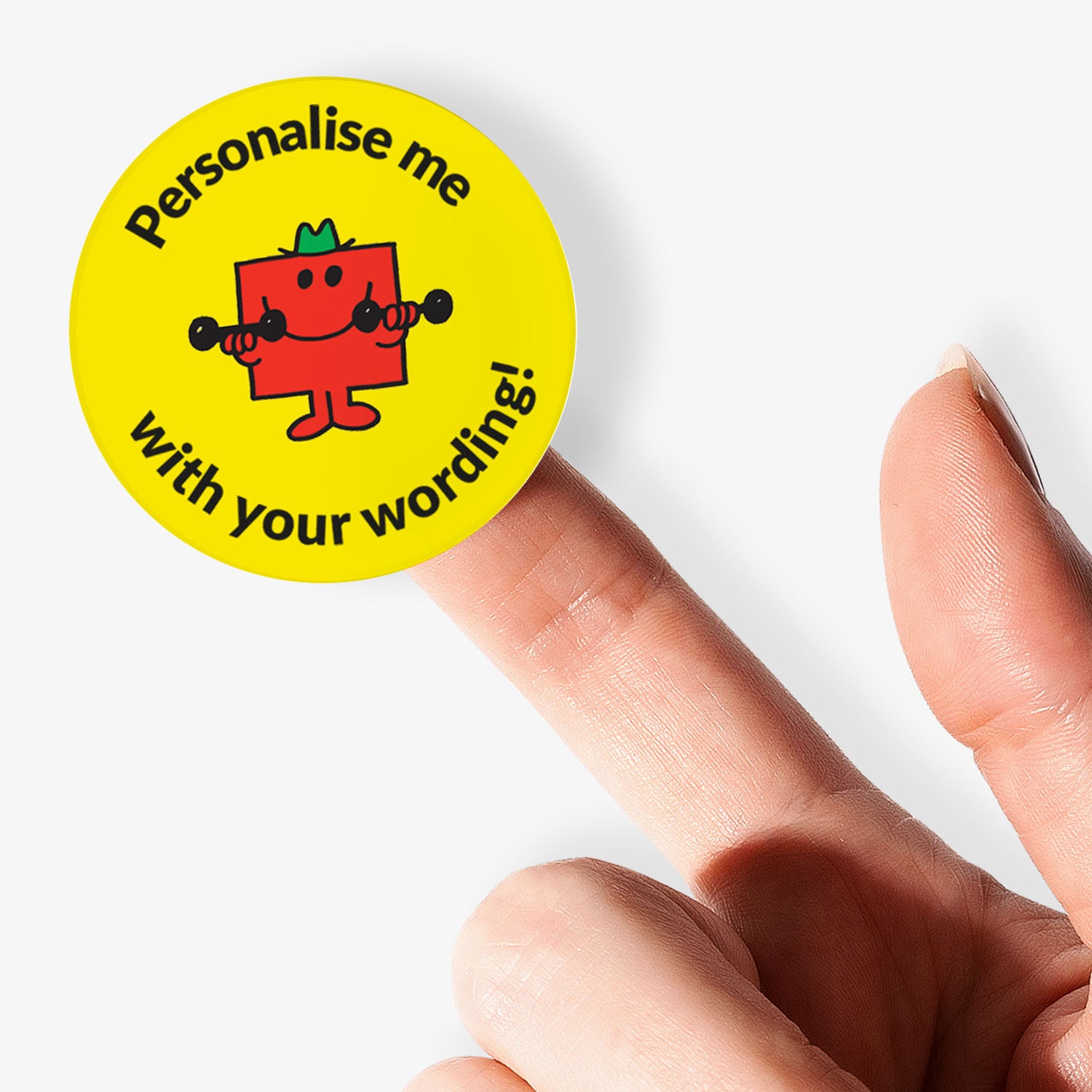 Yellow sticker with Mr Men character and text 'Personalise me with your wording!' held by a hand.