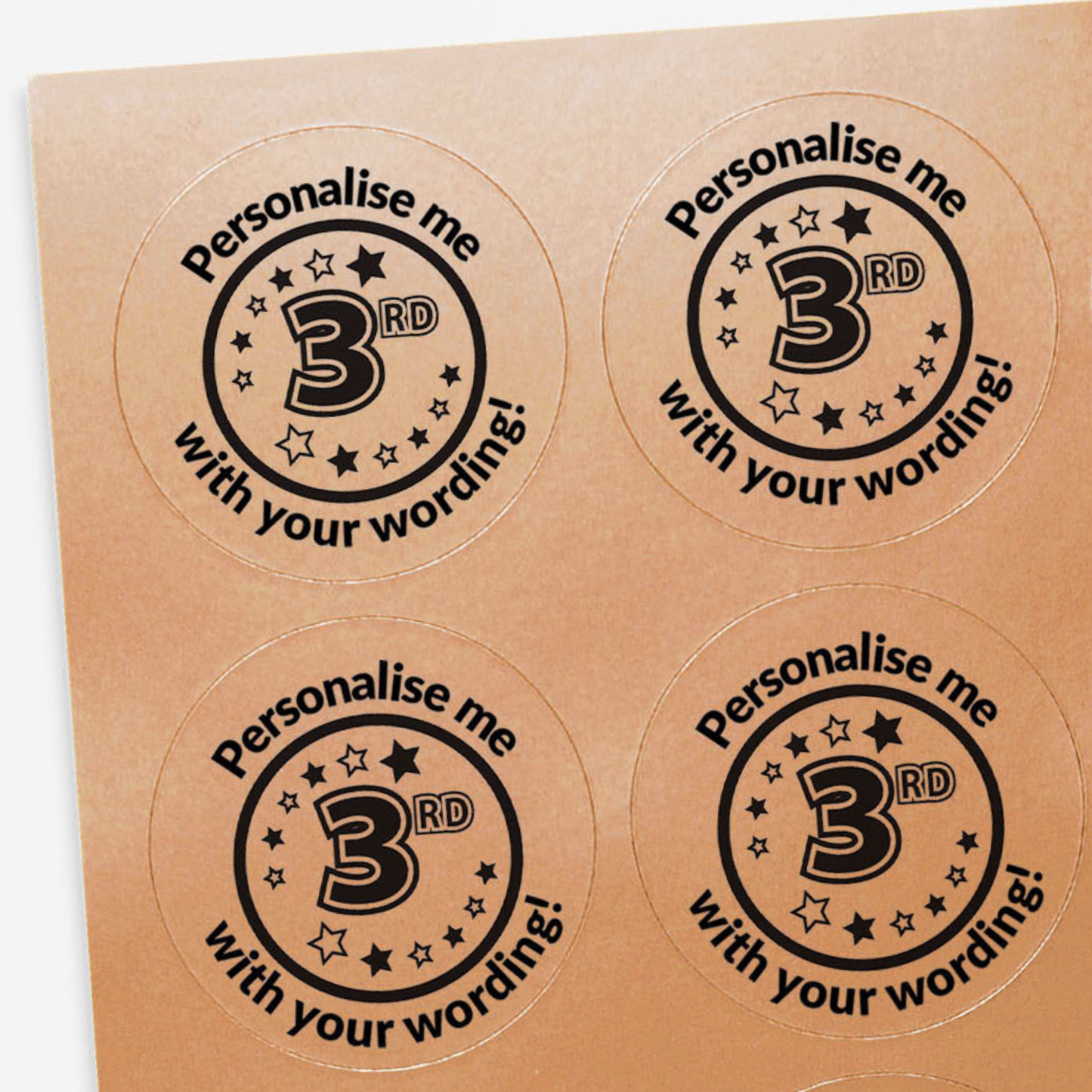 Four round stickers with customizable text on a bronze background