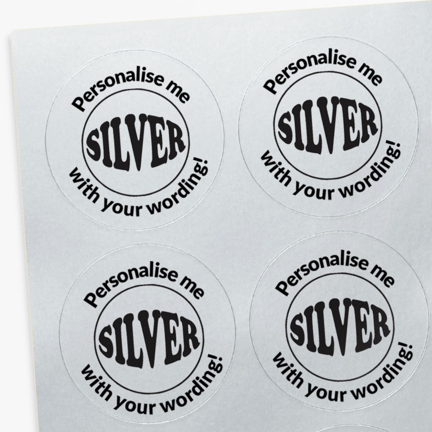Four round stickers with 'Personalise me SILVER with your wording!' text on a white background