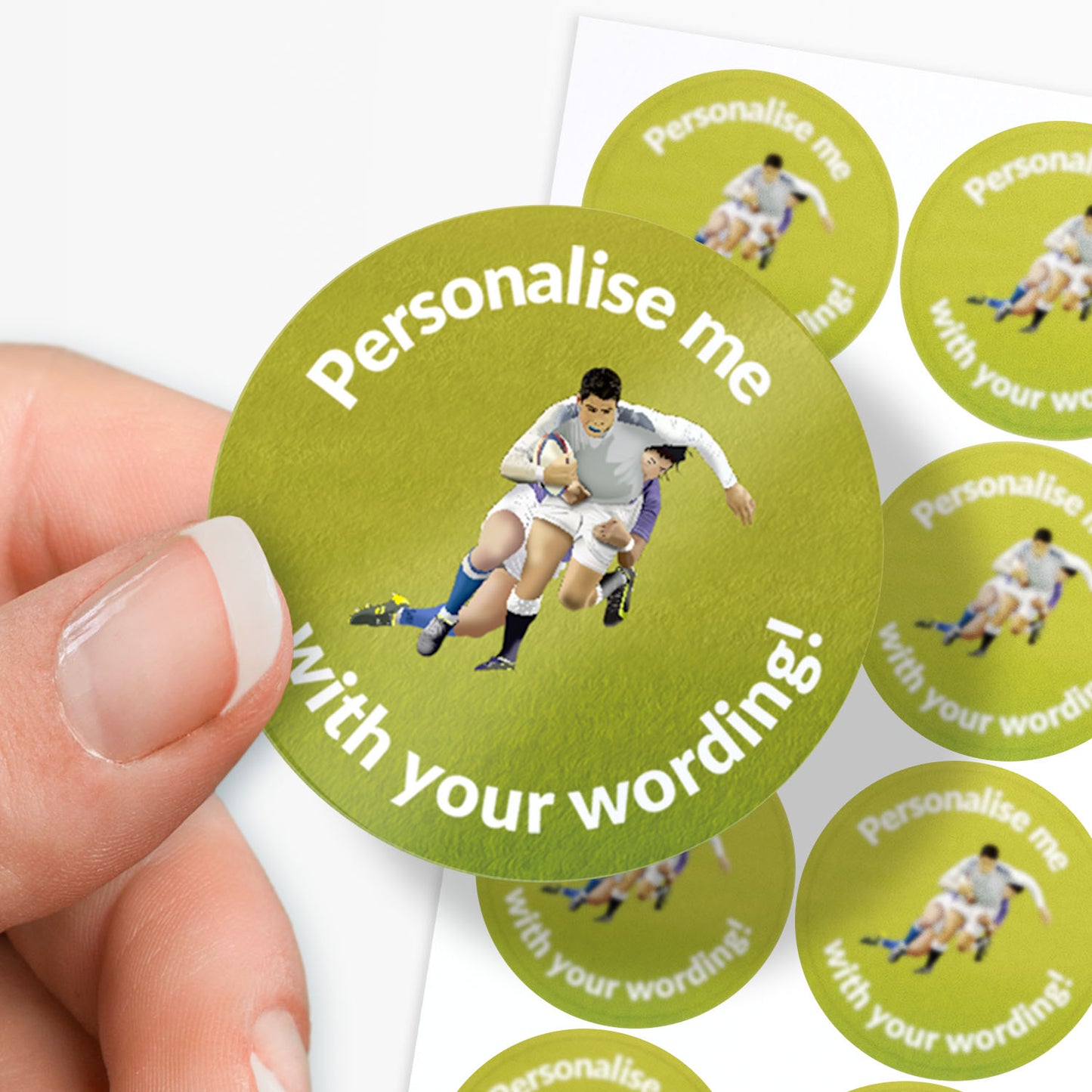 Green round sticker with a sports scene and text 'Personalise me with your wording!' held by a hand.
