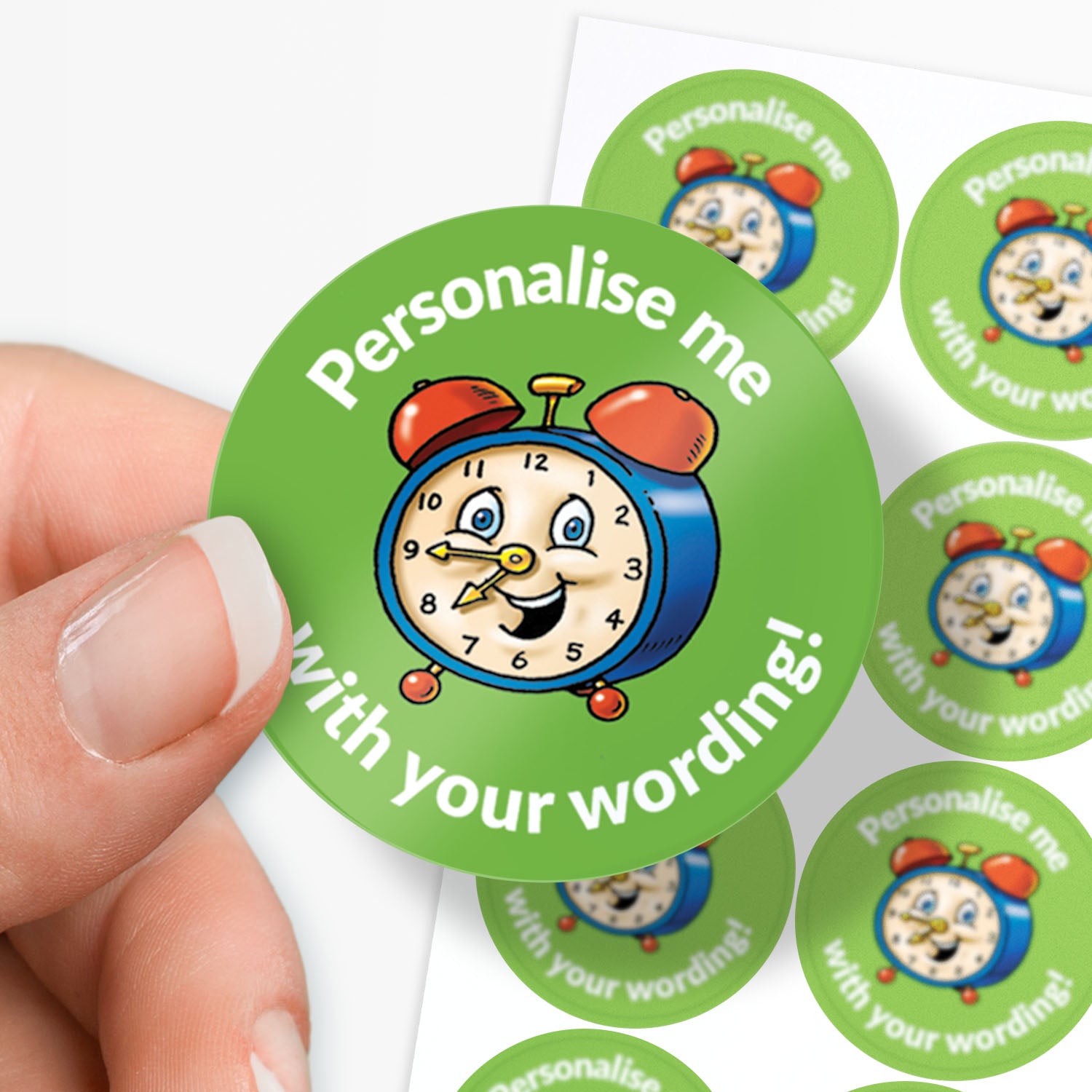 Circular green sticker with a clock design and text 'Personalise me with your wording!' held by a hand.