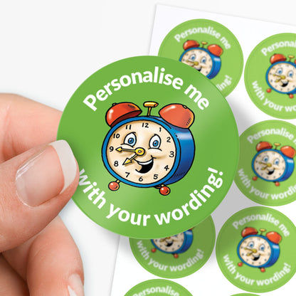 Circular green sticker with a clock design and text 'Personalise me with your wording!' held by a hand.