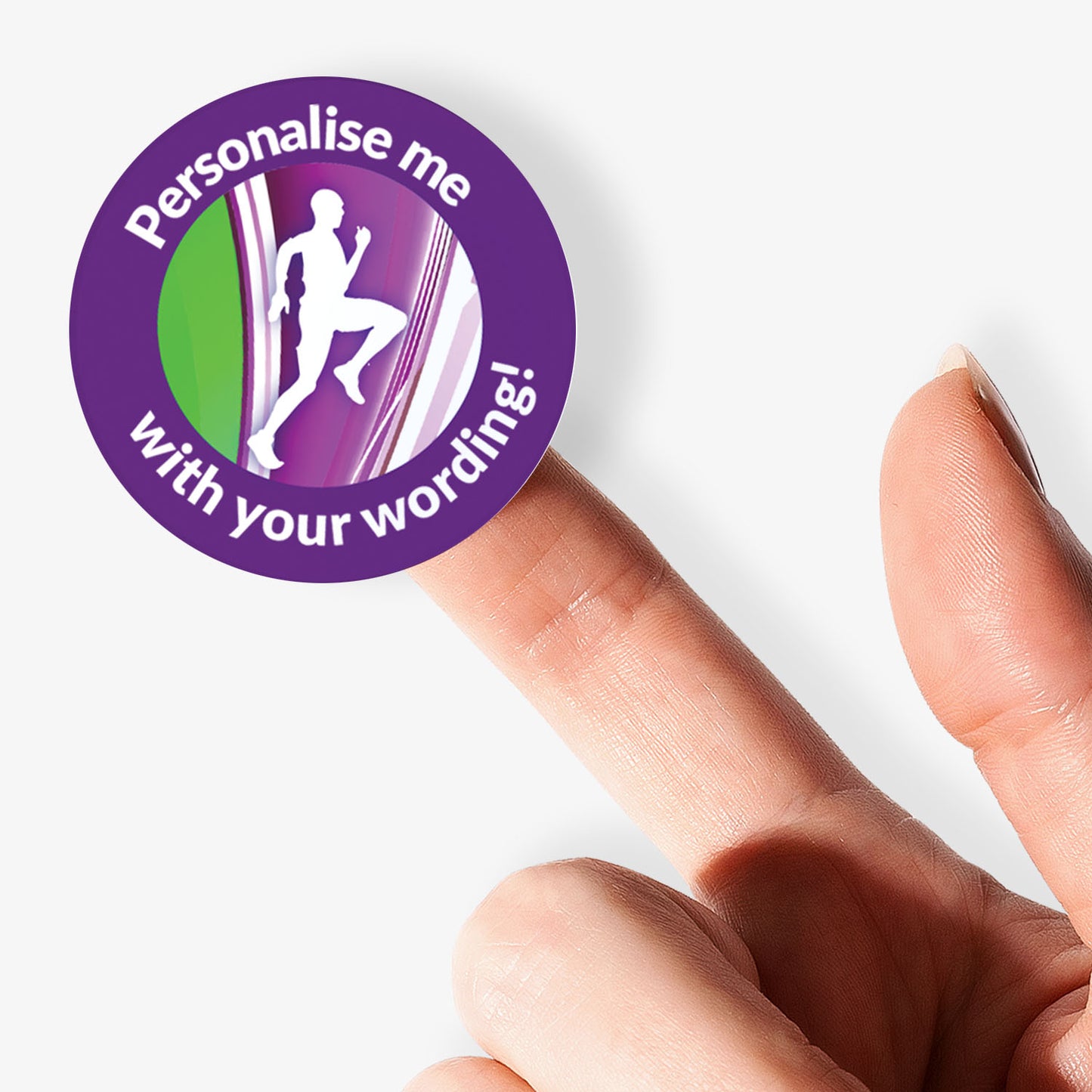 Circular sticker with text 'Personalise me with your wording!' held between fingers on a white background