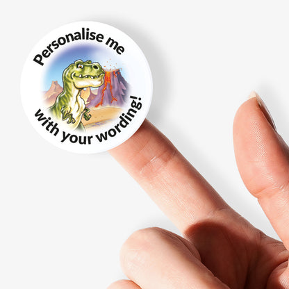 Round customizable sticker with a dinosaur graphic and text on a finger