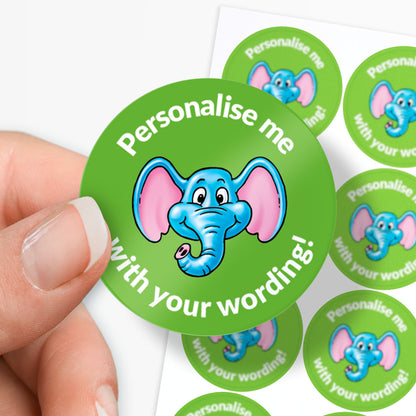 Green sticker with blue elephant design and text 'Personalise me with your wording!' held by a hand.
