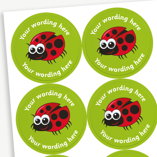 A sheet of green stickers featuring a central image of a cartoon ladybird.  Placeholder text 'Your wording here' is above and below the image.