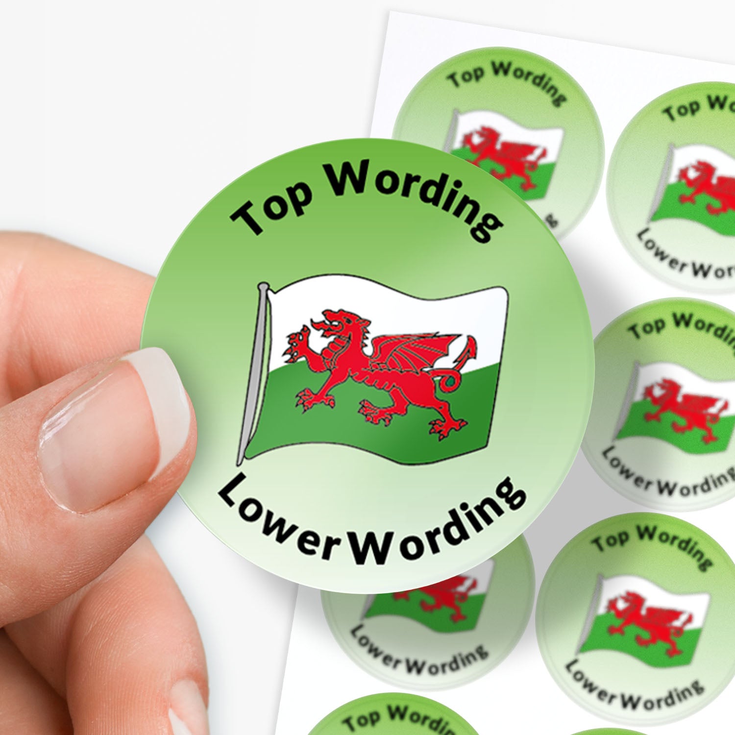 Green round sticker with red dragon flag held by a hand, surrounded by more stickers on a white background.