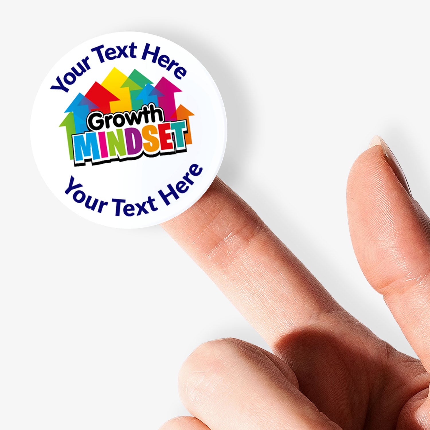 Colorful 'Growth Mindset' button held by a hand on a white background