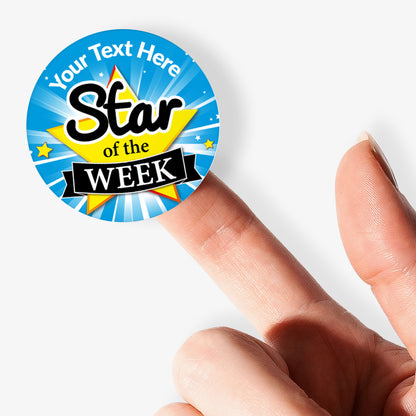 Circular sticker with 'Star of the Week' text held between fingers