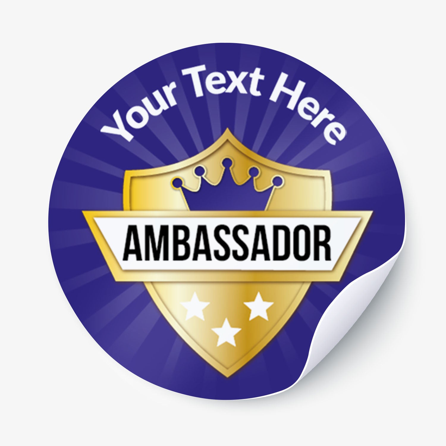 Round sticker with 'Your Text Here' text, gold shield design, and 'Ambassador' text on a blue background.