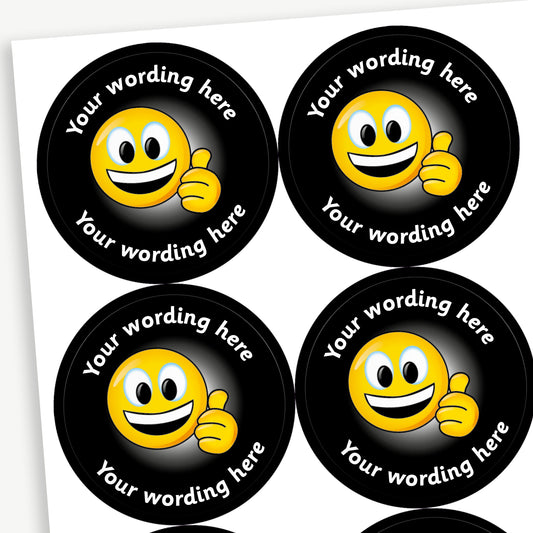 A sheet of black stickers featuring smiling emoji with a thumbs up in the centre.  Placeholder text 'Your wording here' is above and below the image for customisation.