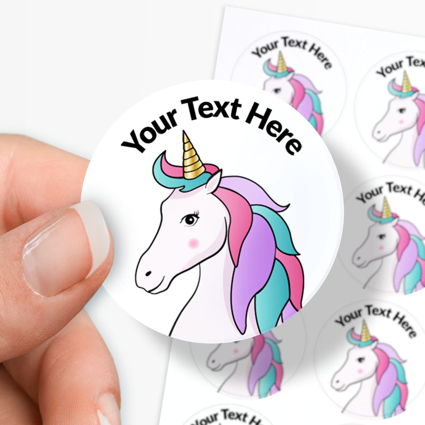 White stickers with a unicorn image.  Space for personalisation above the image.