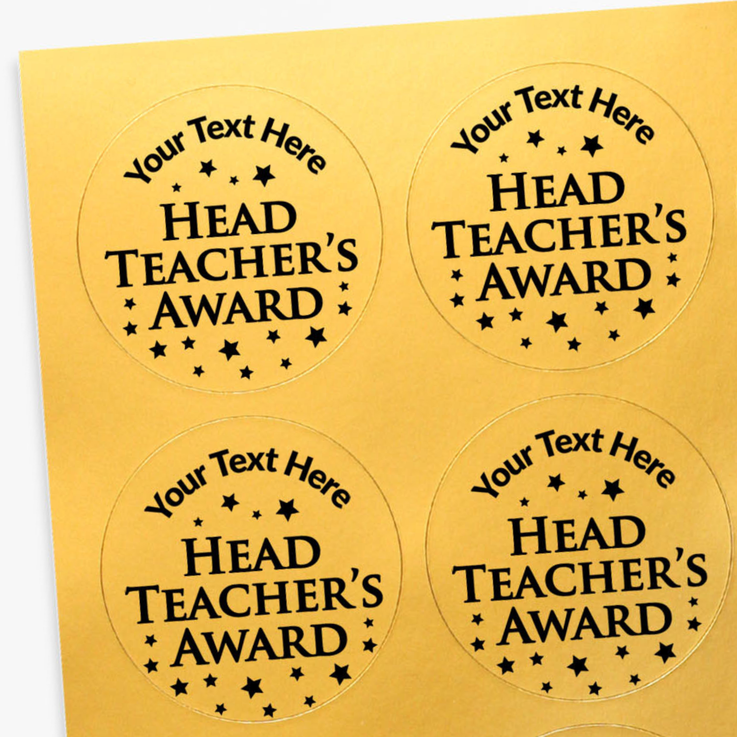 Four round 'Head Teacher's Award' stickers on a gold background