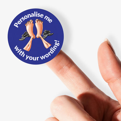 Blue sticker, on a finger, with a 2 feet with socks to the side as the central image.  Space for personalisation above and below the image.