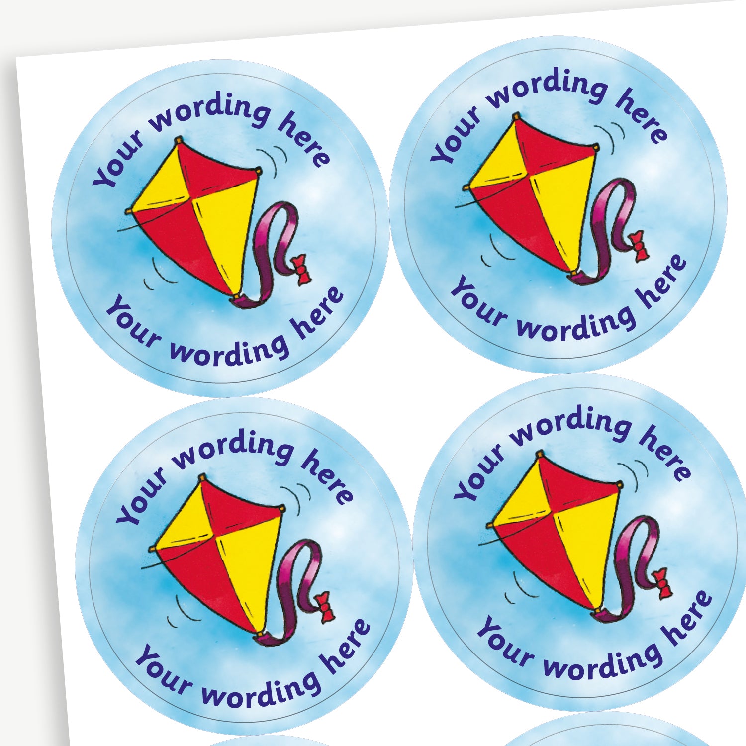 A sheet of blue sky stickers featuring a central image of a red and yellow kite.  Placeholder text 'Your wording here' is above and below the image.