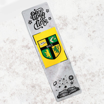 Decorative bookmark with a school crest and text on a textured surface