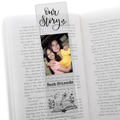 Clear acrylic friendship-themed bookmark featuring the phrase 'Our Story' at the top, a photo of two friends hugging, and the words 'Best friends' in black font above an illustrated open book with botanical elements.