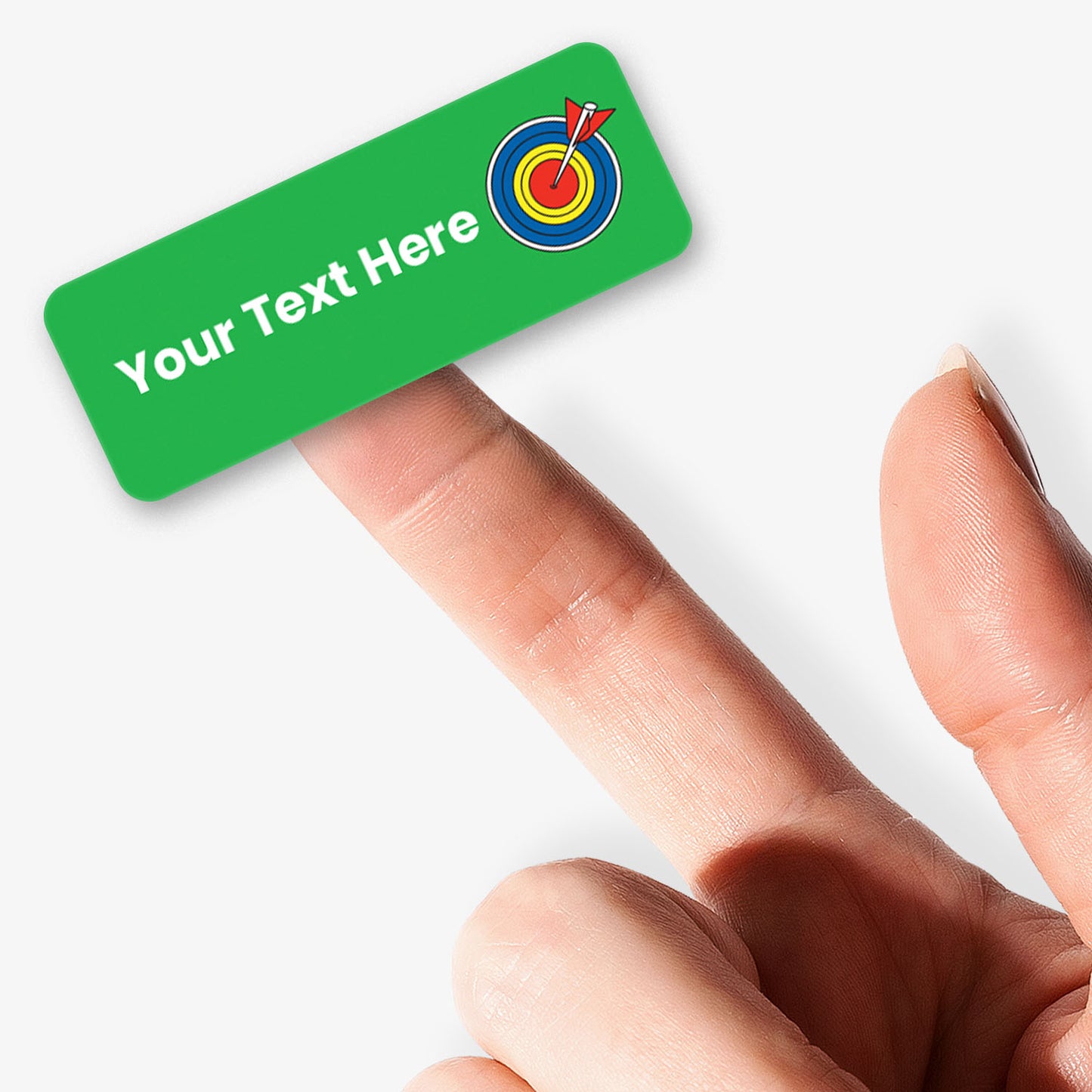 Green sticker with white text and an arrow and target icon held by a hand.