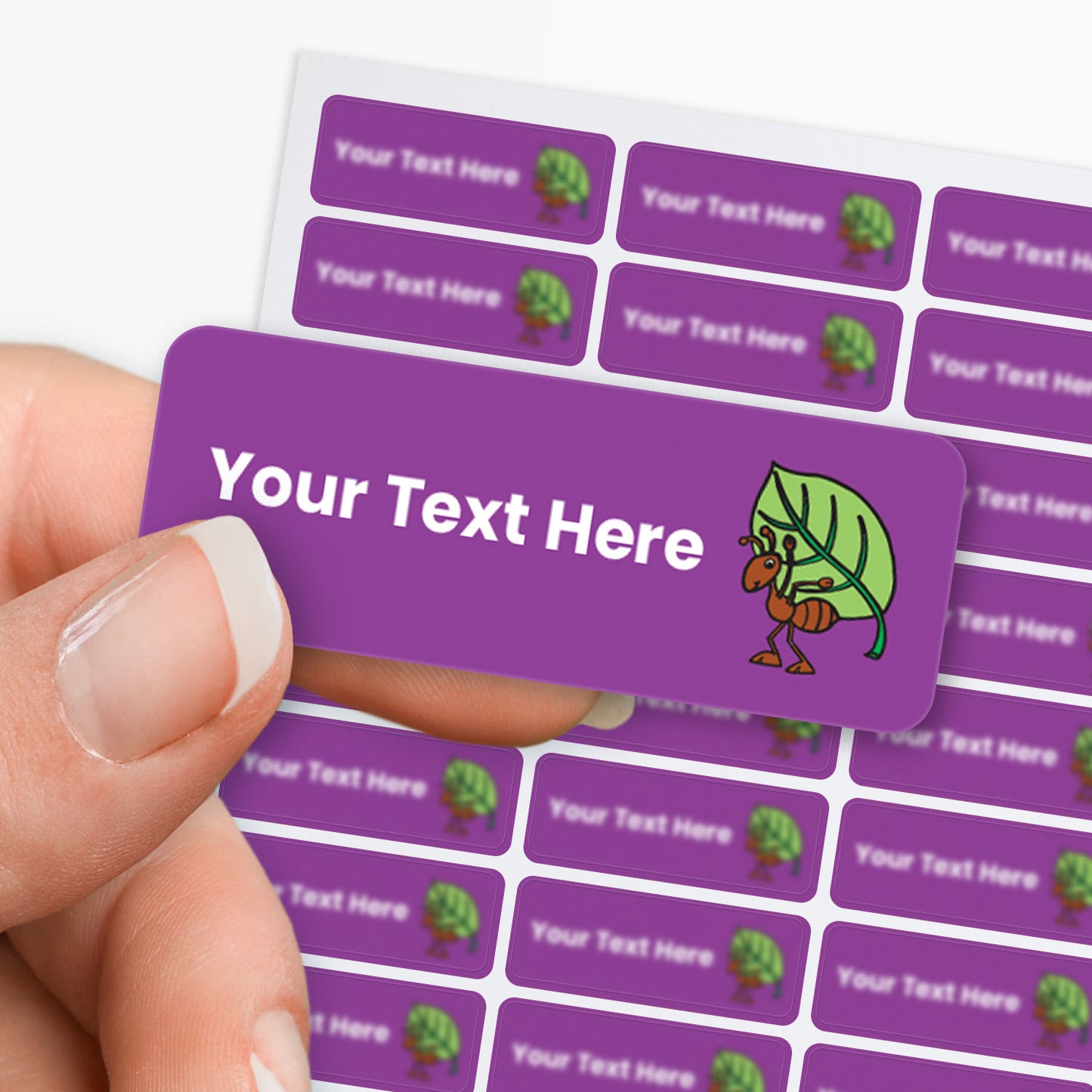 Sheet of Purple stickers with white text and an ant with leaf icon, with a sheet of stickers in the background.