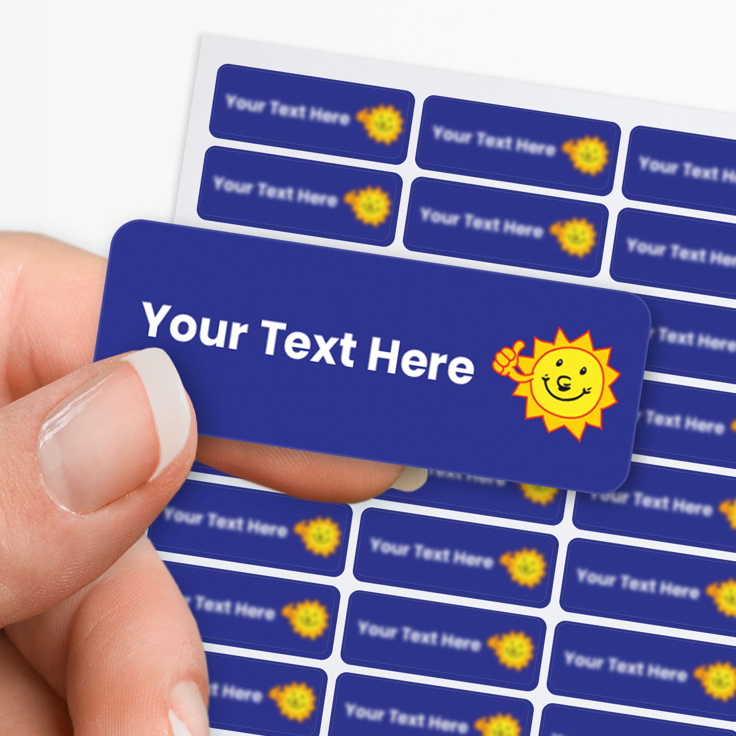 Blue stickers with white text and a sunshine with thumbs up icon held by a hand with a sheet of stickers in the background