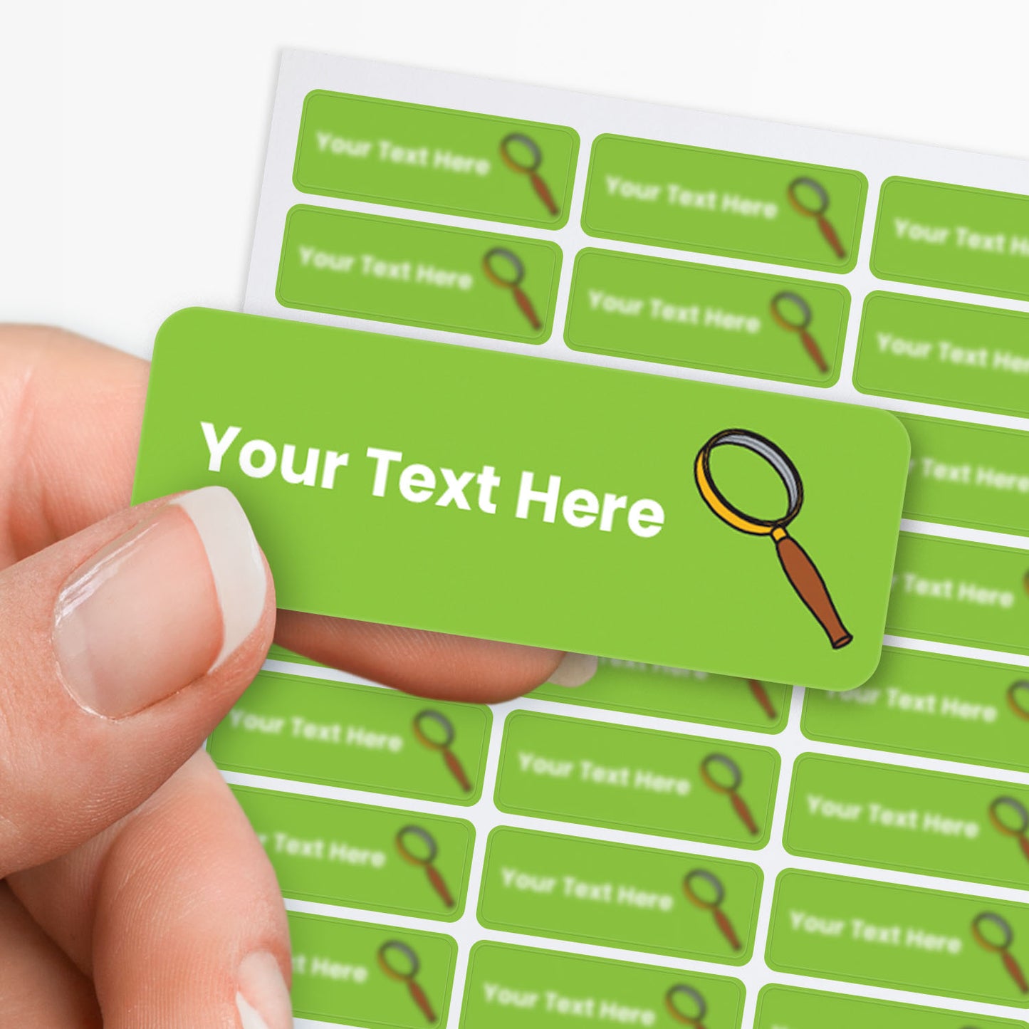 Green label with text 'Your Text Here' held by a hand, surrounded by more labels on a white background.