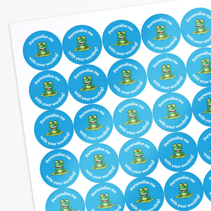 Light blue stickers with a smiling frog as a central image.  Space for personalisation above and below the image.