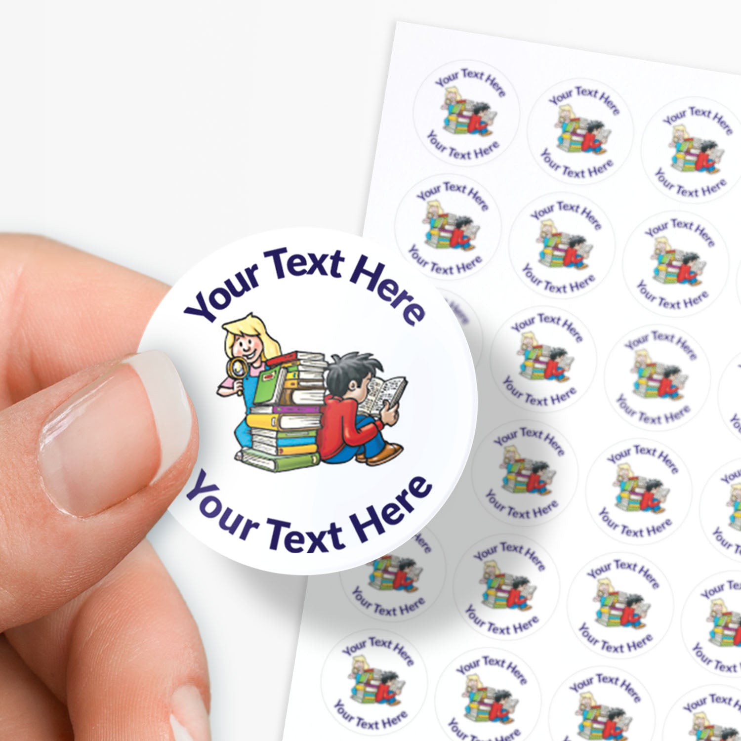 Circular stickers with a children and books image and text on a white background. Sticker being held by a finger and thumb