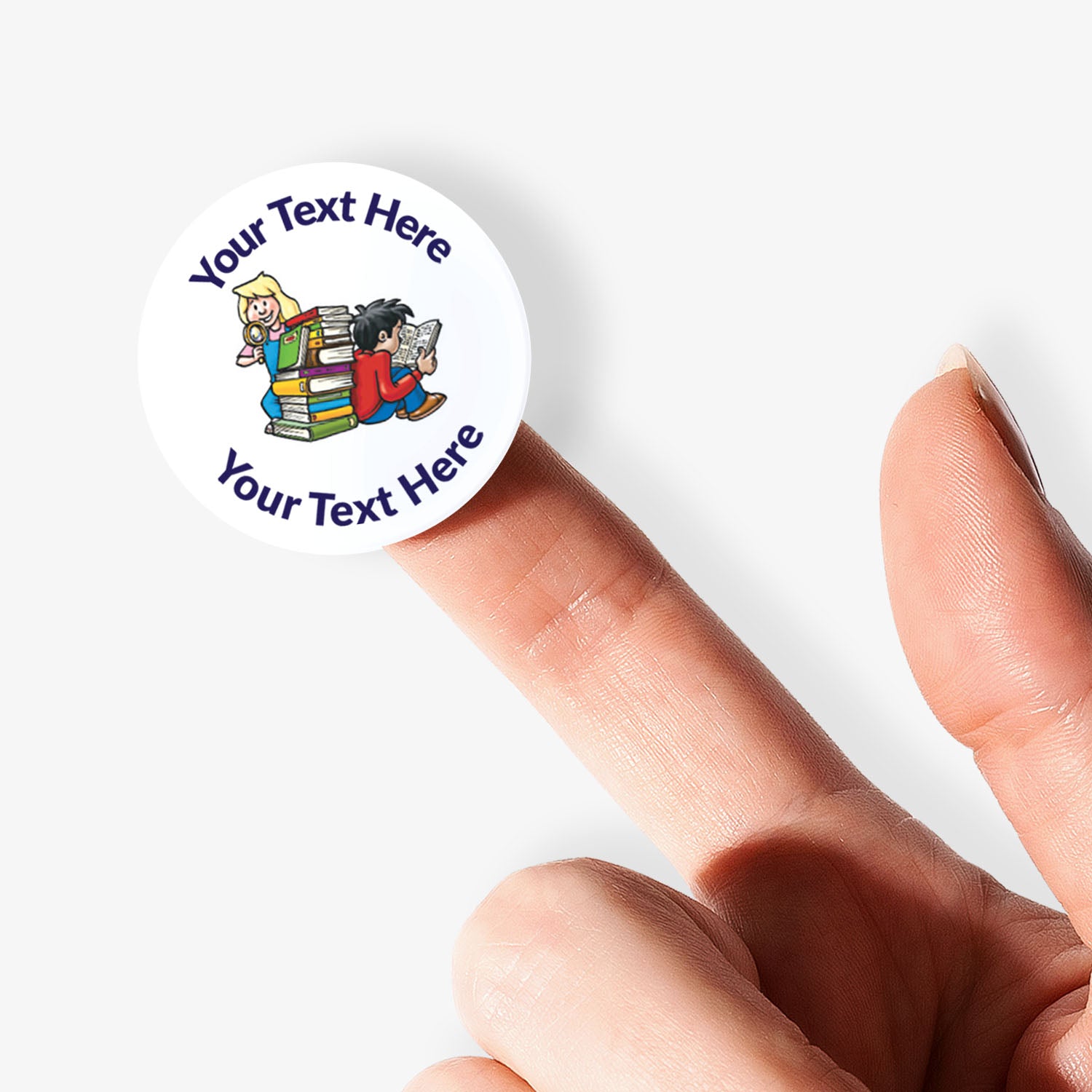 Circular stickers with a children and books image and text on a white background. Sticker being held by a finger