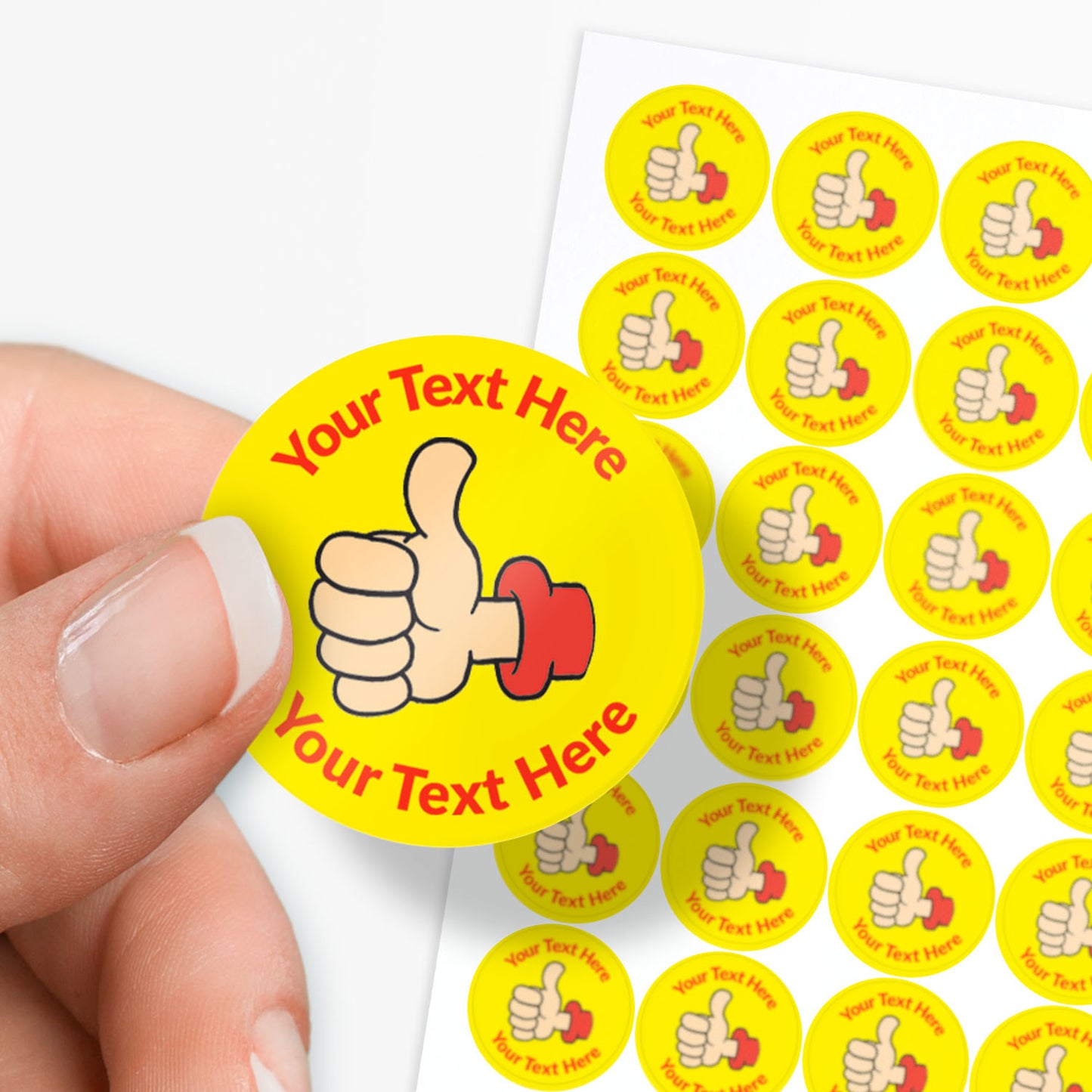 Hand holding a customizable sticker with a thumbs-up icon and text area, surrounded by more stickers on a white background.