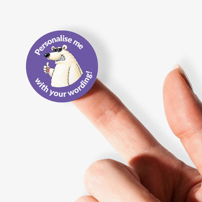 Purple sticker on a finger with a polar bear as a central image.  'Personalise me with your wording!' surrounds the image.