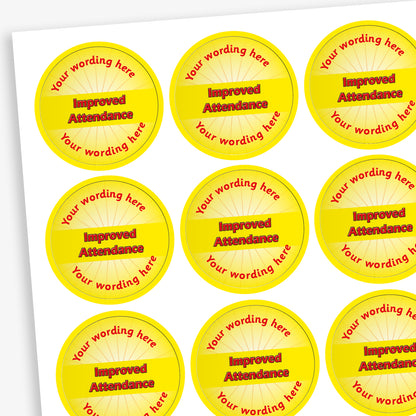 Sheet of 70 personalised 'Improved Attendance' stickers, each 25mm in diameter, featuring a yellow circular design with the text 'Improved Attendance' in bold red letters and space for custom wording above and below, ideal for recognising pupils' attendance improvements.
