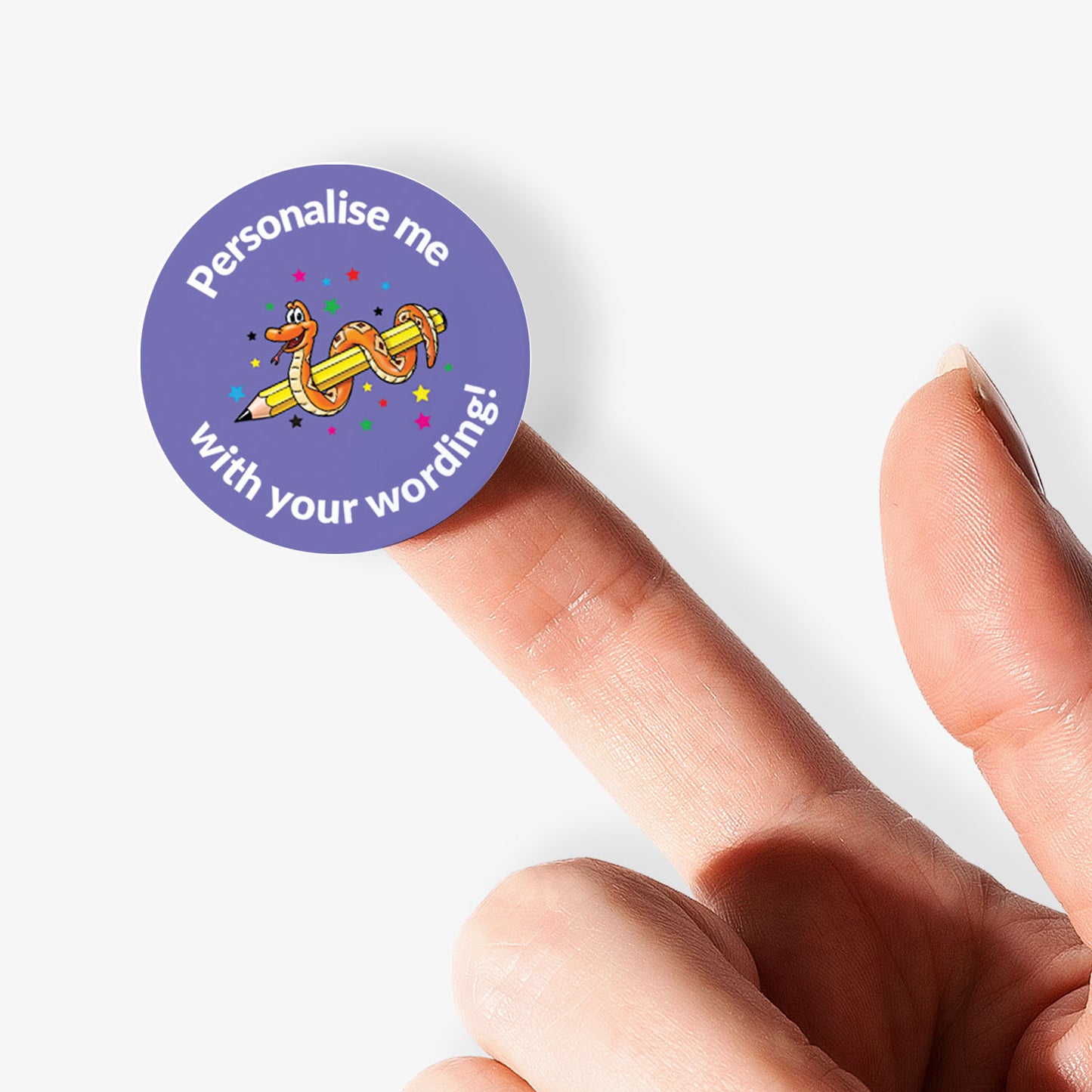 Round purple sticker with text and a cartoon snake character on a finger against a white background