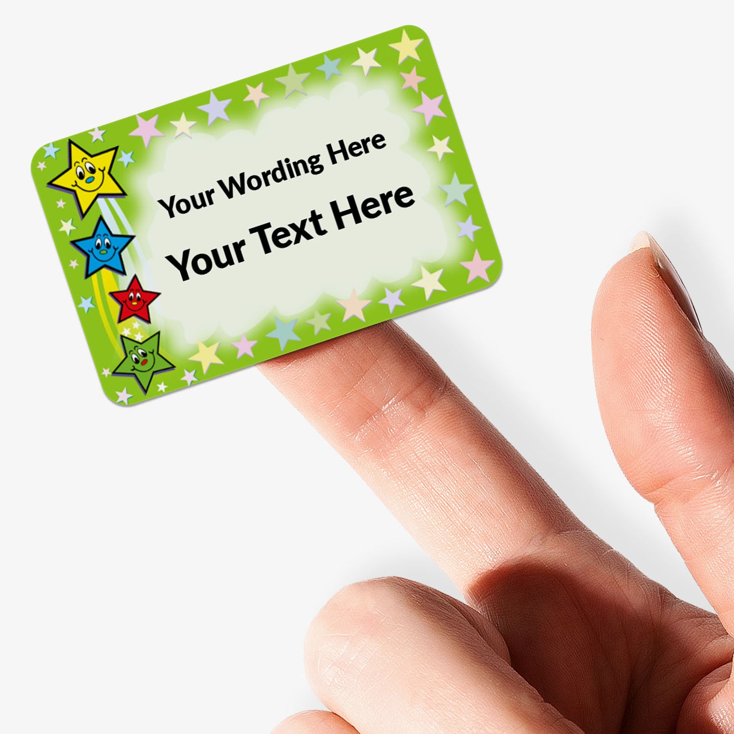 Colorful rectangular sticker with star designs held by a hand on a white background