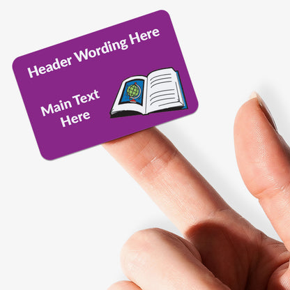 Purple stickers with white text and a book icon held by a hand