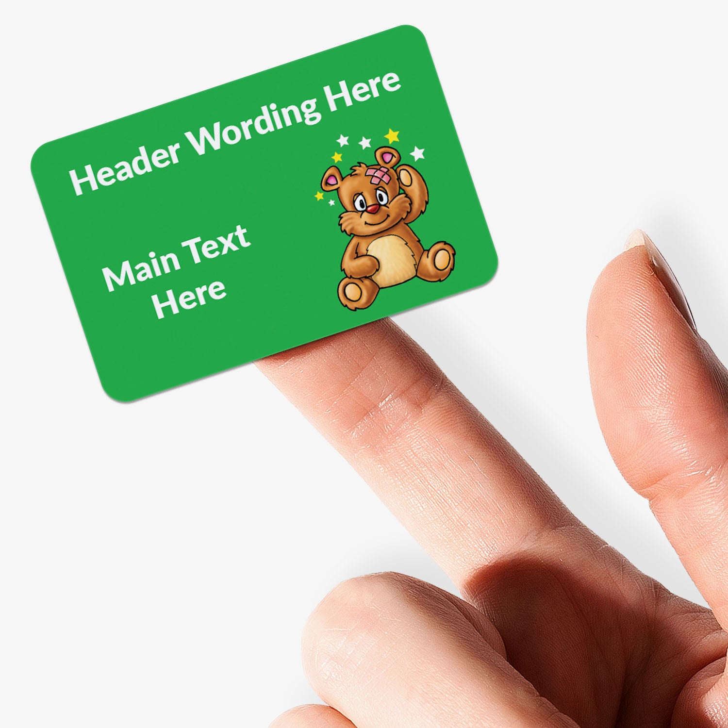 Green card with a teddy bear illustration held by a hand on a white background