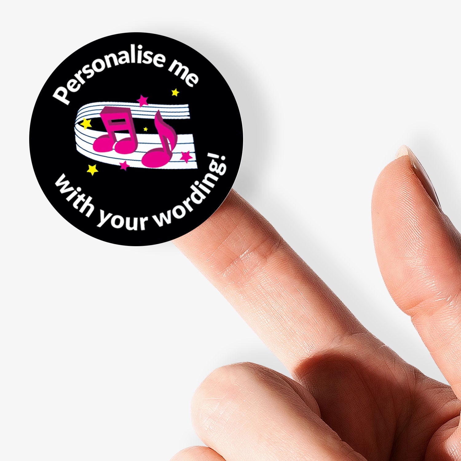 Round sticker with musical notes and text 'Personalise me with your wording!' held between fingers.
